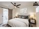 Relaxing bedroom with ceiling fan, ensuite bathroom, and modern decor at 6544 N 7Th Ave # 14, Phoenix, AZ 85013