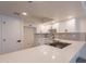 Modern kitchen featuring white cabinets, quartz countertops, stainless steel appliances, and a bright, efficient design at 6544 N 7Th Ave # 14, Phoenix, AZ 85013