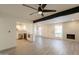 Bright, open-concept living area with wood flooring, stylish lighting, and a modern kitchen and fireplace at 6544 N 7Th Ave # 14, Phoenix, AZ 85013