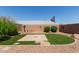 Backyard showcasing gravel, artificial turf, decorative features, and desert landscaping at 6610 E University Dr # 2, Mesa, AZ 85205