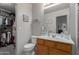 Bathroom featuring a vanity, lighting, a closet, with the water closet in view at 6610 E University Dr # 2, Mesa, AZ 85205