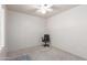 Empty carpeted bedroom features bright interior and ceiling fan with bright interior at 6610 E University Dr # 2, Mesa, AZ 85205