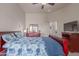 Bedroom featuring a bed, dresser, television, ensuite bathroom, and cozy carpet at 6610 E University Dr # 2, Mesa, AZ 85205