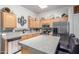 Modern kitchen featuring stainless steel appliances, ample counter space, and a central island at 6610 E University Dr # 2, Mesa, AZ 85205