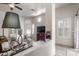 Open-concept living room features bright interior, tile floor, and natural light from windows at 6610 E University Dr # 2, Mesa, AZ 85205