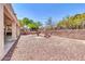 Low maintenance backyard with gravel, seating, and privacy wall at 7532 E Sierra Morena Cir, Mesa, AZ 85207