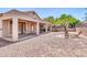 Spacious backyard with a stone patio and desert landscaping at 7532 E Sierra Morena Cir, Mesa, AZ 85207