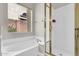 Bright bathroom featuring a soaking tub, separate glass-enclosed shower, and a window for natural light at 7532 E Sierra Morena Cir, Mesa, AZ 85207