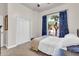 Comfortable bedroom with closet and window with blue curtains at 7532 E Sierra Morena Cir, Mesa, AZ 85207