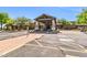 Community clubhouse featuring a porte cochere and well-maintained landscaping at 7532 E Sierra Morena Cir, Mesa, AZ 85207