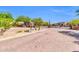 Gated community entrance with desert landscaping and upscale homes in the background at 7532 E Sierra Morena Cir, Mesa, AZ 85207