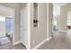 Inviting hallway featuring tiled floors, neutral walls, and doorways leading to various rooms in the home at 7532 E Sierra Morena Cir, Mesa, AZ 85207