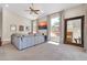 Bright living room features large windows, neutral walls, plush carpet and a large mirror at 7532 E Sierra Morena Cir, Mesa, AZ 85207