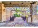 Outdoor lounge area with comfortable seating, pergola, and brick-paved patio at 7532 E Sierra Morena Cir, Mesa, AZ 85207