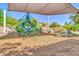 Modern playground with a unique geometric climbing structure and shade cover, set on a soft, wood-chip surface at 7532 E Sierra Morena Cir, Mesa, AZ 85207