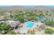 Aerial shot of a luxurious community pool area with lap lanes, spa, and ample lounge seating, perfect for relaxation at 7532 E Sierra Morena Cir, Mesa, AZ 85207