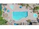 Aerial view showcases a large community pool with lap lanes, a free-form pool, and a hot tub, surrounded by lounge chairs at 7532 E Sierra Morena Cir, Mesa, AZ 85207