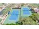 Aerial view showcases pristine tennis courts, providing a great recreational amenity for the community residents to enjoy at 7532 E Sierra Morena Cir, Mesa, AZ 85207