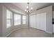 Bright dining area featuring tile floors, neutral paint, bay window and closet at 7549 W Yucca St, Peoria, AZ 85345