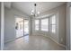 Inviting dining area with bright windows and sliding door access to the patio area at 7549 W Yucca St, Peoria, AZ 85345