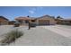 Charming single-story home with desert landscaping, gravel yard, and a two-car garage at 7549 W Yucca St, Peoria, AZ 85345
