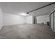 Spacious garage with concrete floor, water heater, and garage door at 7549 W Yucca St, Peoria, AZ 85345