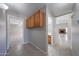 Neutral hallway with tile flooring, and views into rooms at either end at 7549 W Yucca St, Peoria, AZ 85345