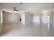 Spacious living room featuring tile floors, a ceiling fan, and neutral paint at 7549 W Yucca St, Peoria, AZ 85345