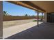 Covered patio with a view of the spacious backyard, showcasing outdoor living and relaxation at 7549 W Yucca St, Peoria, AZ 85345