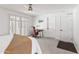 This bedroom offers a ceiling fan, shutters, wood floors, and a spacious layout, perfect for a home office setup at 8007 E Del Tesoro Dr, Scottsdale, AZ 85258