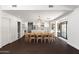 Open dining room with a modern chandelier, seamlessly connecting to the updated kitchen at 8007 E Del Tesoro Dr, Scottsdale, AZ 85258