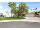 Modern home with well-manicured landscaping, a brick driveway, and a two-car garage at 8007 E Del Tesoro Dr, Scottsdale, AZ 85258