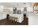 Bright, updated kitchen featuring a center island with seating and modern stainless appliances at 8007 E Del Tesoro Dr, Scottsdale, AZ 85258