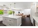 Modern kitchen with center island, views to the dining room, living room, and backyard at 8007 E Del Tesoro Dr, Scottsdale, AZ 85258