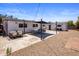 This backyard boasts a dining area, sitting area and outbuilding with gravel, concrete and brick at 8022 E Columbus Ave, Scottsdale, AZ 85251