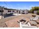 The backyard features a brick firepit with seating and an outbuilding at 8022 E Columbus Ave, Scottsdale, AZ 85251
