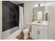 Stylish bathroom with a sleek vanity and black tiled shower at 8022 E Columbus Ave, Scottsdale, AZ 85251