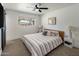 Cozy bedroom featuring a ceiling fan and a bright window at 8022 E Columbus Ave, Scottsdale, AZ 85251