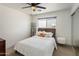 Comfortable bedroom with soft carpeting, ample natural light, and modern decor at 8022 E Columbus Ave, Scottsdale, AZ 85251