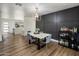 Elegant dining room with modern light fixture, marble table, and wine bar at 8022 E Columbus Ave, Scottsdale, AZ 85251