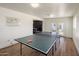 Open concept game room boasting a ping pong table and ample space at 8022 E Columbus Ave, Scottsdale, AZ 85251