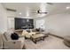 Spacious living room with plush seating, ceiling fan, and decorative rug at 8022 E Columbus Ave, Scottsdale, AZ 85251