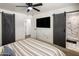 Serene main bedroom featuring a modern ceiling fan and bathroom access at 8022 E Columbus Ave, Scottsdale, AZ 85251