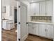Convenient pantry with ample cabinet space and stylish backsplash at 8022 E Columbus Ave, Scottsdale, AZ 85251