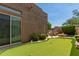 Scenic backyard featuring a putting green, outdoor grill area, and beautiful landscaping at 8324 E Cactus Wren Rd, Scottsdale, AZ 85250