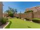 Backyard putting green with a fire pit and a well-landscaped yard at 8324 E Cactus Wren Rd, Scottsdale, AZ 85250