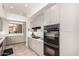 Well-lit kitchen featuring modern appliances, gas stove, and plenty of cabinet storage space at 8324 E Cactus Wren Rd, Scottsdale, AZ 85250
