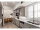 Well-equipped kitchen boasts modern stainless steel appliances and access to the breakfast nook at 8324 E Cactus Wren Rd, Scottsdale, AZ 85250