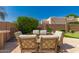 Charming outdoor dining area with seating for six and a landscaped backdrop at 8324 E Cactus Wren Rd, Scottsdale, AZ 85250
