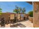Outdoor kitchen featuring a built-in grill and bar seating for entertaining at 8324 E Cactus Wren Rd, Scottsdale, AZ 85250